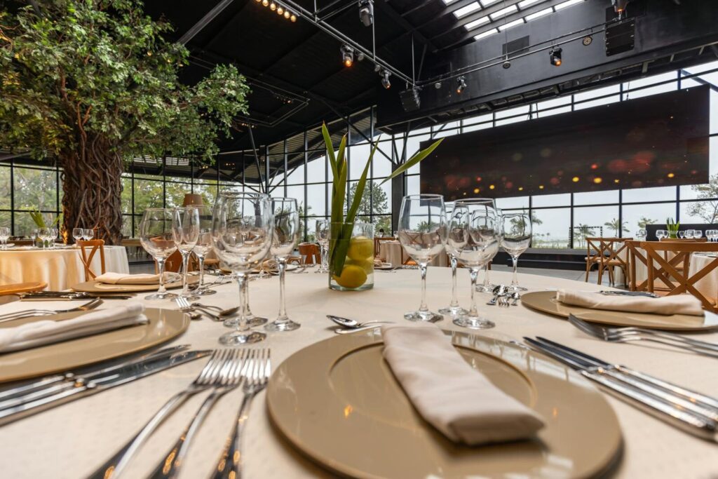 Sophisticated restaurant table setup with elegant dinnerware and modern decor, perfect for celebrations.